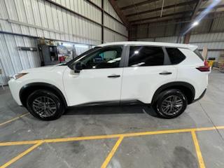 White Nissan Rogue side profile after detail