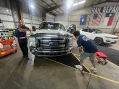 NAF Gloss Boss team at work in the shop